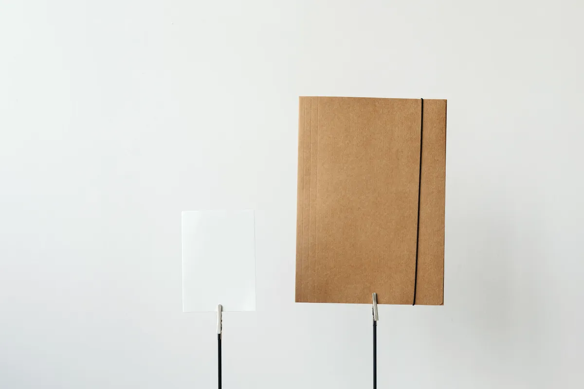 A single sheet of paper on a plain bright desk